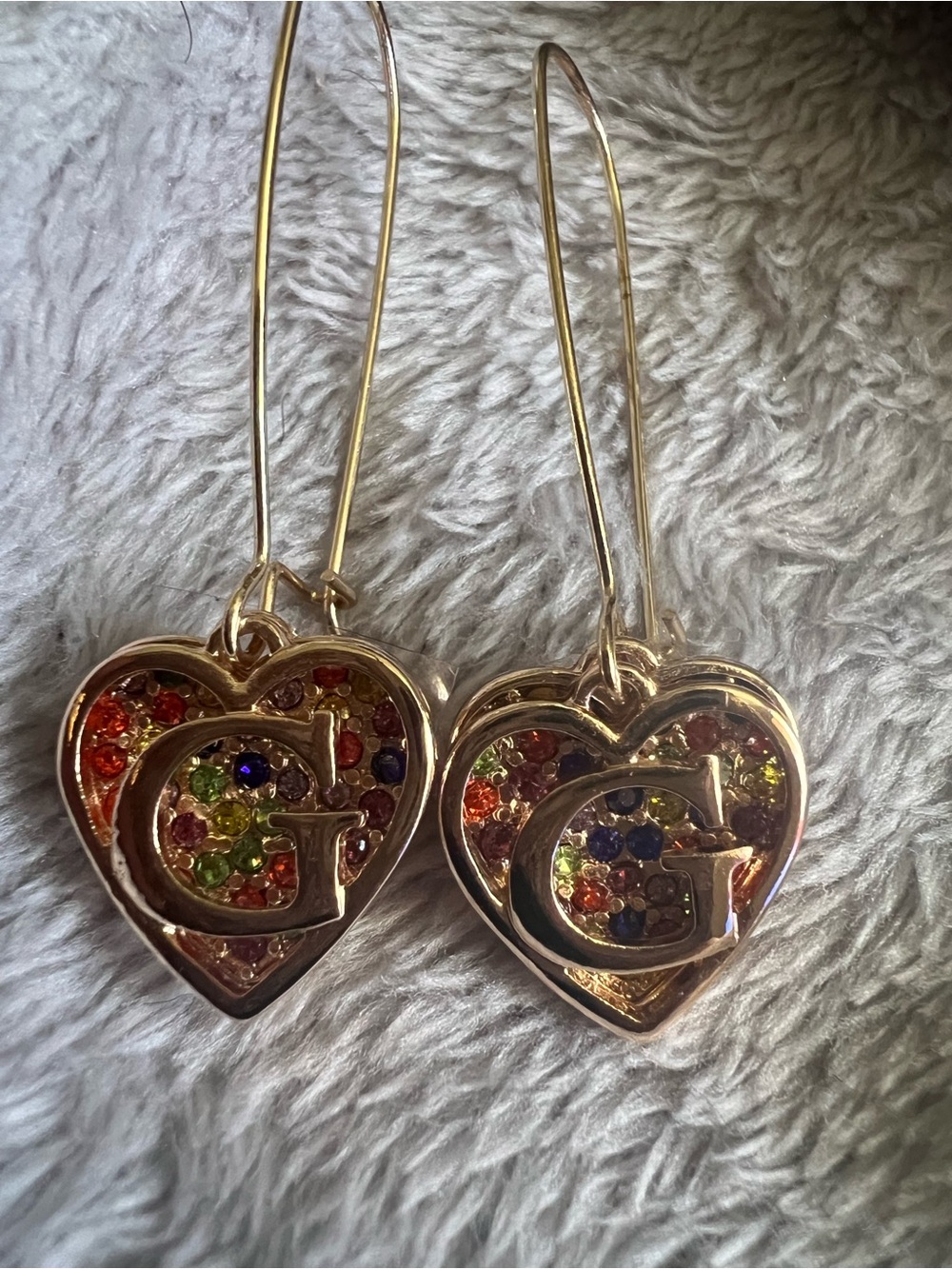 Guess Gold Tone Rainbow Pave Logo Heart Linear Drop Earrings, new without tags